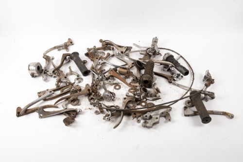 LEVERS / GRIPS / GAITERS: A tub of assorted levers, twistgrips & a pair of NOS fork gaiters