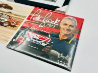 PETER BROCK: A framed print of Peter Brock racing in HDT Toranas, together with a unframed colour print of the LJ Torana L34 and an unopened 2024 calendar [Location: Sydney] - 2