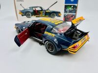 CHEVROLET CAMARO: A 1:18 scale model by Classic Carlectables of the Chevrolet Camaro in Kevin Bartlett's Channel 9 #9 livery, in original packaging together with a colour photo mounted on board showing the car at Bathurst in 1981 [Location: Sydney] - 6