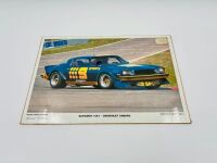 CHEVROLET CAMARO: A 1:18 scale model by Classic Carlectables of the Chevrolet Camaro in Kevin Bartlett's Channel 9 #9 livery, in original packaging together with a colour photo mounted on board showing the car at Bathurst in 1981 [Location: Sydney] - 12