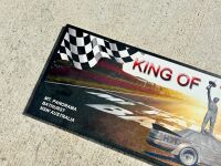 KING OF THE MOUNTAIN: A metal board depicting Peter Brock at Bathurst, 100cm wide by 30cm high [Location: Sydney] - 2