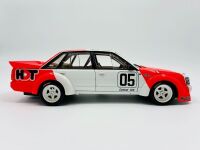 HOLDEN VK COMMODORE: A 1:18 scale model by Biante of the Peter Brock/Larry Perkins #05 car in original packaging, together with a cushion depicting a similar car [Location: Sydney] - 2