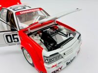 HOLDEN VK COMMODORE: A 1:18 scale model by Biante of the Peter Brock/Larry Perkins #05 car in original packaging, together with a cushion depicting a similar car [Location: Sydney] - 4