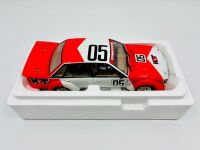 HOLDEN VK COMMODORE: A 1:18 scale model by Biante of the Peter Brock/Larry Perkins #05 car in original packaging, together with a cushion depicting a similar car [Location: Sydney] - 9