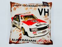 HOLDEN VK COMMODORE: A 1:18 scale model by Biante of the Peter Brock/Larry Perkins #05 car in original packaging, together with a cushion depicting a similar car [Location: Sydney] - 12