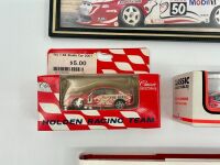 MARK SKAIFE: A hardcover autobiography 'Mark Skaife: The Complete Illustrated Autobiography of One of Australia's Most Successful Touring Car Drivers', together with two 1:64 scale models by Classic Carlectables and three photos including one signed. [Loc - 4