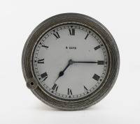 DASH CLOCK: A 1920s or 1930s eight days dash clock, white with black Roman numeral numbering, lens width 7.5cm, overall width 9.5cm
