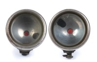 CAV LAMPS: Two CAV (England) side lamps with small red cut glass lens at rear, lens diameter 9cm