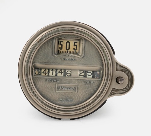 STEWART: A circa 1920s or 1930s Stewart (USA) model 124 oval roller speedometer with separate trip counter, lens diameter 7.2cm