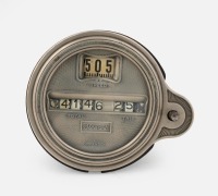 STEWART: A circa 1920s or 1930s Stewart (USA) model 124 oval roller speedometer with separate trip counter, lens diameter 7.2cm
