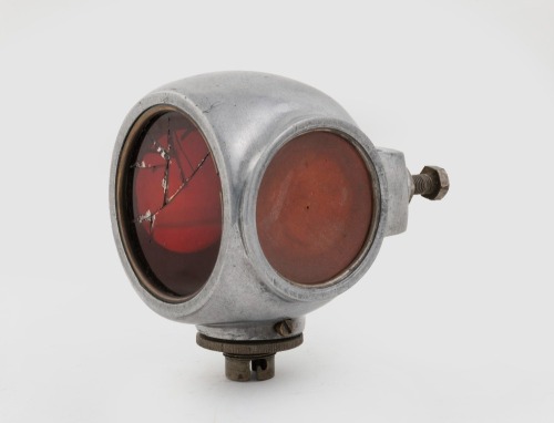 TAIL LAMP: A circa 1920s three lens divers helmet tail lamp, largest lens diameter 6.5cm, length overall 10.5cm