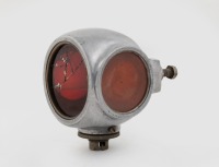TAIL LAMP: A circa 1920s three lens divers helmet tail lamp, largest lens diameter 6.5cm, length overall 10.5cm