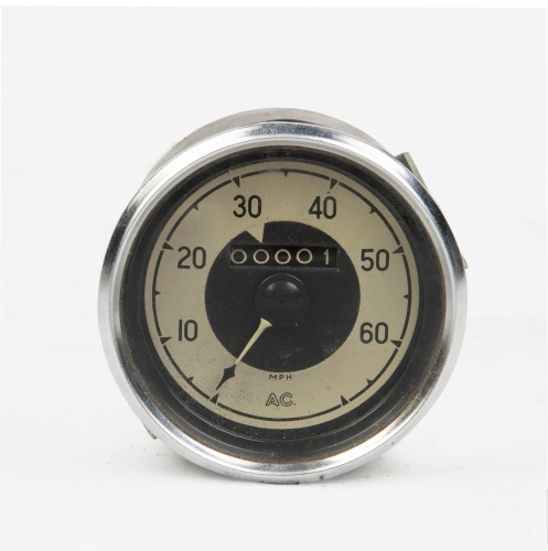 SPEEDOMETER: A NOS AC 60 MPH speedometer, 9cm lens diameter