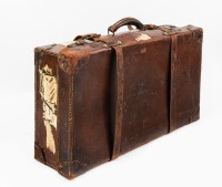 SUITCASE: A vintage bullock hide suitcase circa 1920s / 1930s, with leather straps & functioning locks. length 66cm, width 40cm, depth 18cm