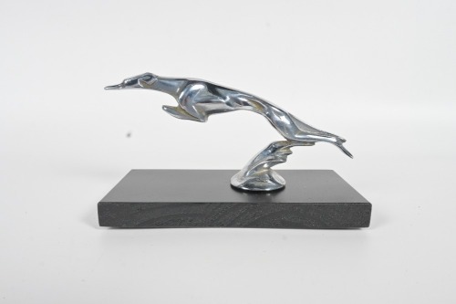 GREYHOUND MASCOT: A circa 1920s C. Brau Art-Deco greyhound mascot, commonly used on Delage, Lincoln & Ford, affixed to timber base, 19.5cm long