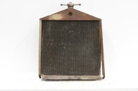 RADIATOR: A circa 1910s or 1920s US made radiator, includes core, surround and 'dog-bone' cap, 76cm high, 61cm wide