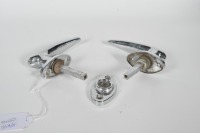 DOOR HANDLES: Two circa 1920s to 1950s chrome door handles, one with lock and also including one partial bracket piece