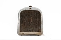 RADIATOR: A circa late 1910s radiator believed to be Dodge Brothers, includes the core, surround & cap, 69cm high, 56cm wide