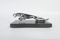 JAGUAR: A circa 1960s to 1980s Jaguar 'leaping Jaguar' mascot, to suit various models, 20cm long, affixed to timber base