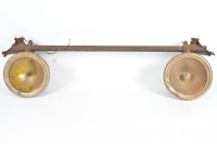 GUIDE HEADLAMPS: Two Guide 'Tilt-Ray' headlamps fixed to bar, lens width 19cm, bar length 1.10m - 2