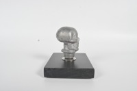 SKULL KNOB: An alloy human skull gear knob affixed to timber base, knob 7cm high - 5