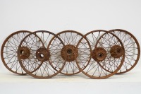 WIRE WHEELS: A group of five wire wheels, all approx 64cm in diameter and 6.5cm wide