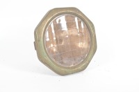 HEADLIGHT: A large circa 1920s headlight with dome shaped housing & octagonal lens surround, with Macbeth-Evans Liberty lens, lens diameter 21.5cm