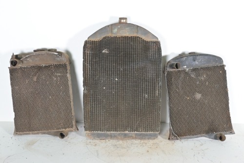 RADIATORS: Three radiators, includes one with Harrison Cooled (USA) tag (H 79cm x W50cm), and two smaller radiators