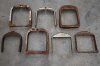 RADIATOR SURROUNDS: A group of seven radiator surrounds, includes two Ford surrounds