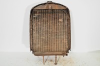 STUDEBAKER: A circa 1920s Studebaker radiator with core & surround, also with enamel badge, 77cm high, 54cm wide - 2
