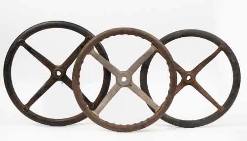 STEERING WHEELS: Three early four spoke steering wheels, all approx 41cm wide