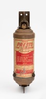 FIRE EXTINGUISHER: A brass Stokes & Sons (Australia) fire extinguisher in holding bracket, 24cm high
