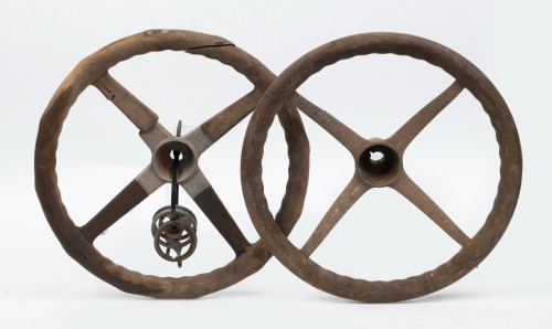 STEERING WHEELS: Two early four spoke wooden rimmed steering wheels, both approx 45cm wide