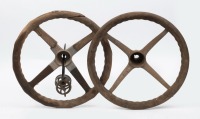 STEERING WHEELS: Two early four spoke wooden rimmed steering wheels, both approx 45cm wide