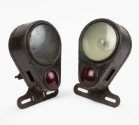TAIL LAMPS: Two closely matching circa 1920s two lens tail lamps, one branded Howe Searchlight & the other King Safety (both USA)