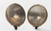 HEADLAMPS: A pair of large headlamps, lens width 24cm, one with Glolite lens