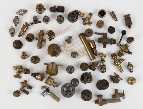 BRASS FITTINGS: An assortment of various early mostly small brass fittings and some dash switches