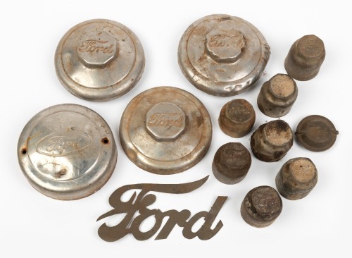 FORD: An assortment of early Ford wheel centre caps of varying sizes & styles, also includes on script badge