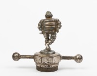 MICHELIN: A nice early nickel plated brass figural mascot of Monsieur Michelin Bibendum, figure 9.5cm high