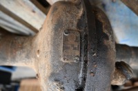 LANCIA: A pallet of assorted Lancia Lambda items, includes axle & differential, leaf springs with brackets, a tailshaft & two half shafts - 5