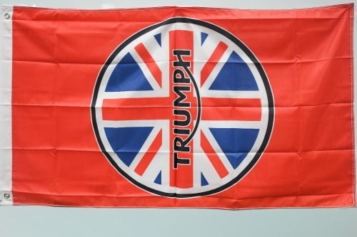 TRIUMPH: A new Triumph Motorcycles flag, 87cm high, 1.55m wide