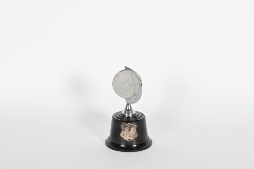 ROGER BARKER: A small 'Finishers Award' trophy from the Redex Motor Cycle Trial, in rotating medallion style, 13cm high