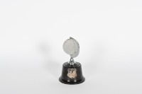 ROGER BARKER: A small 'Finishers Award' trophy from the Redex Motor Cycle Trial, in rotating medallion style, 13cm high