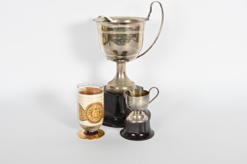 ROGER BARKER: Two twin-handled cup style trophies awarded by the Harley Club to Roger Barker