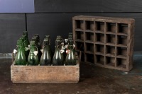 BEER CRATES: A group of two vintage eastern European timber beers crates and green vintage bottles
