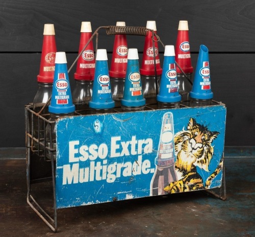 ESSO: A circa 1970s "Esso Extra Multigrade" 10-bottle set and stand, with matching plastic pourers and caps