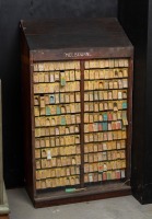 NSW RAILWAYS: An early 20th century hardwood train ticket cabinet with numerous NSW train tickets
