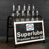 ESSO: A circa 1970s "Esso Superlube Premium Motor Oil 10 bottle set and stand, with matching plastic pourers and caps