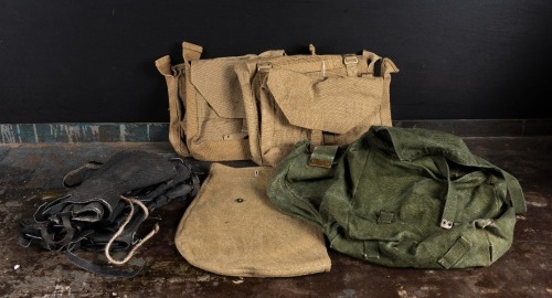 MILITARY BAGS: A collection of vintage military haversacks, together with a group of gaiters