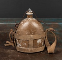 WWII: A WWII Japanese aluminium canteen, with canvas and leather straps